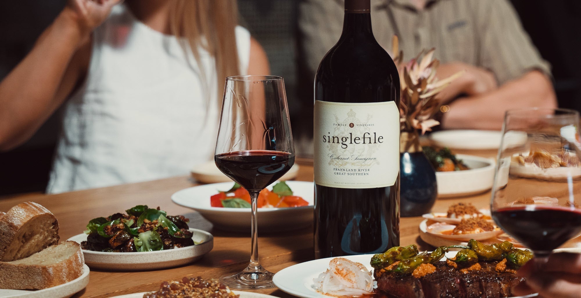 Table laid with food and wine