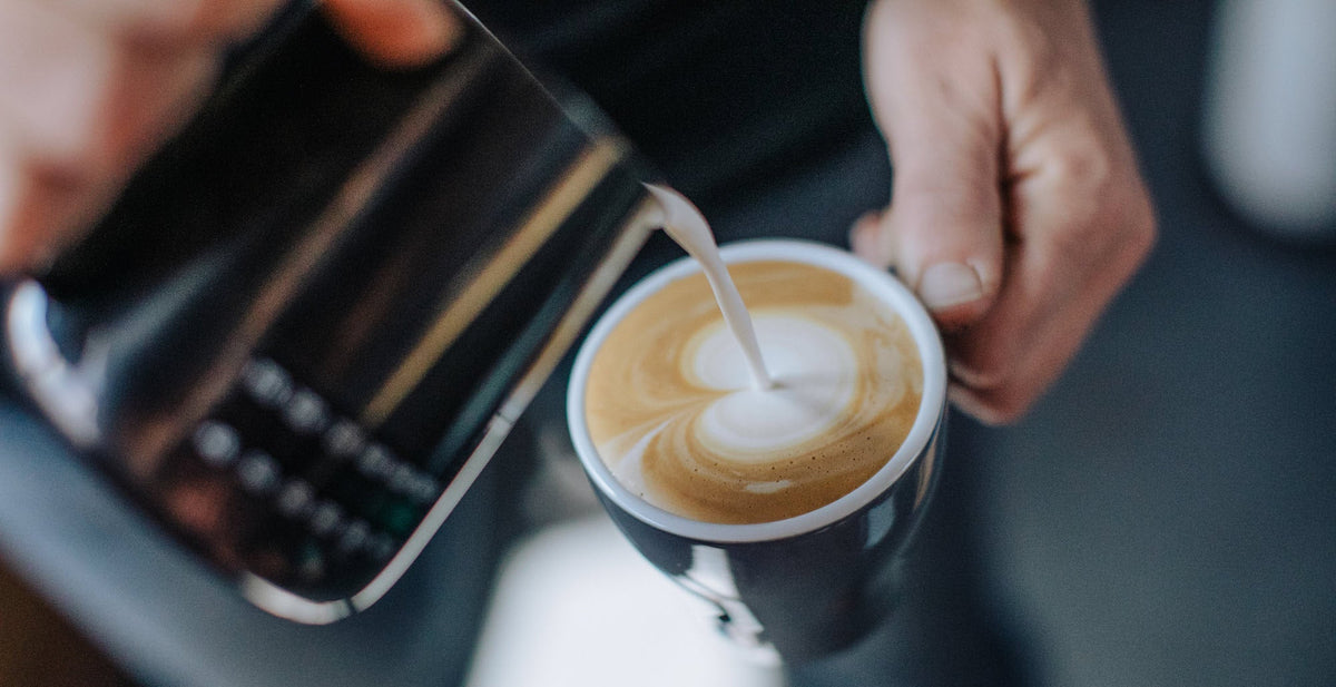 Milk being poured into a latte, cafe coffee in the Great Southern, Western Australia