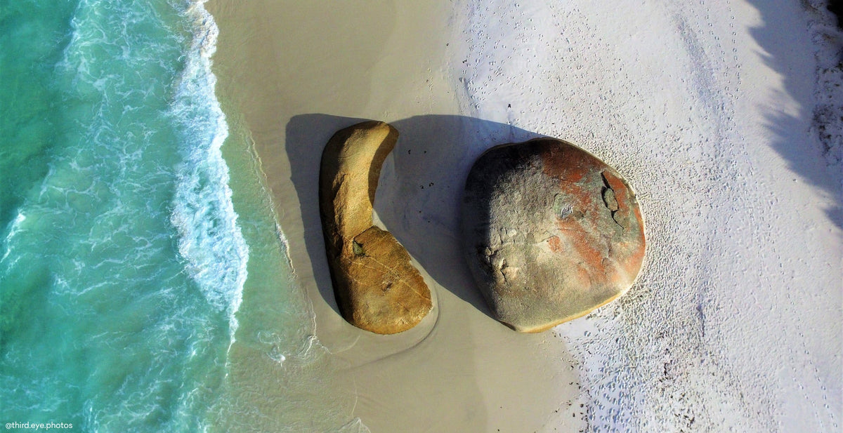 Aerial view of turquoise surf and granite boulders at Little Beach, Albany