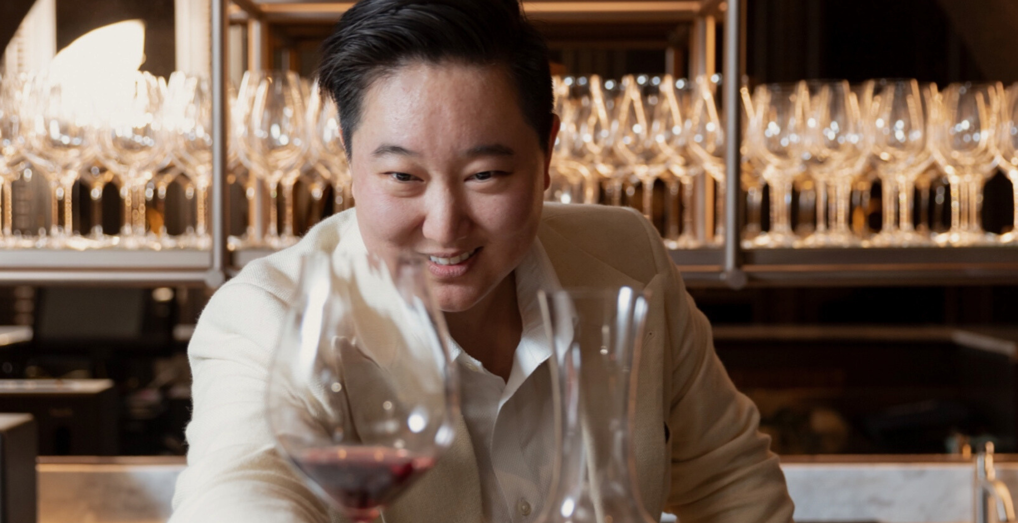 Bew admiring a glass of red wine