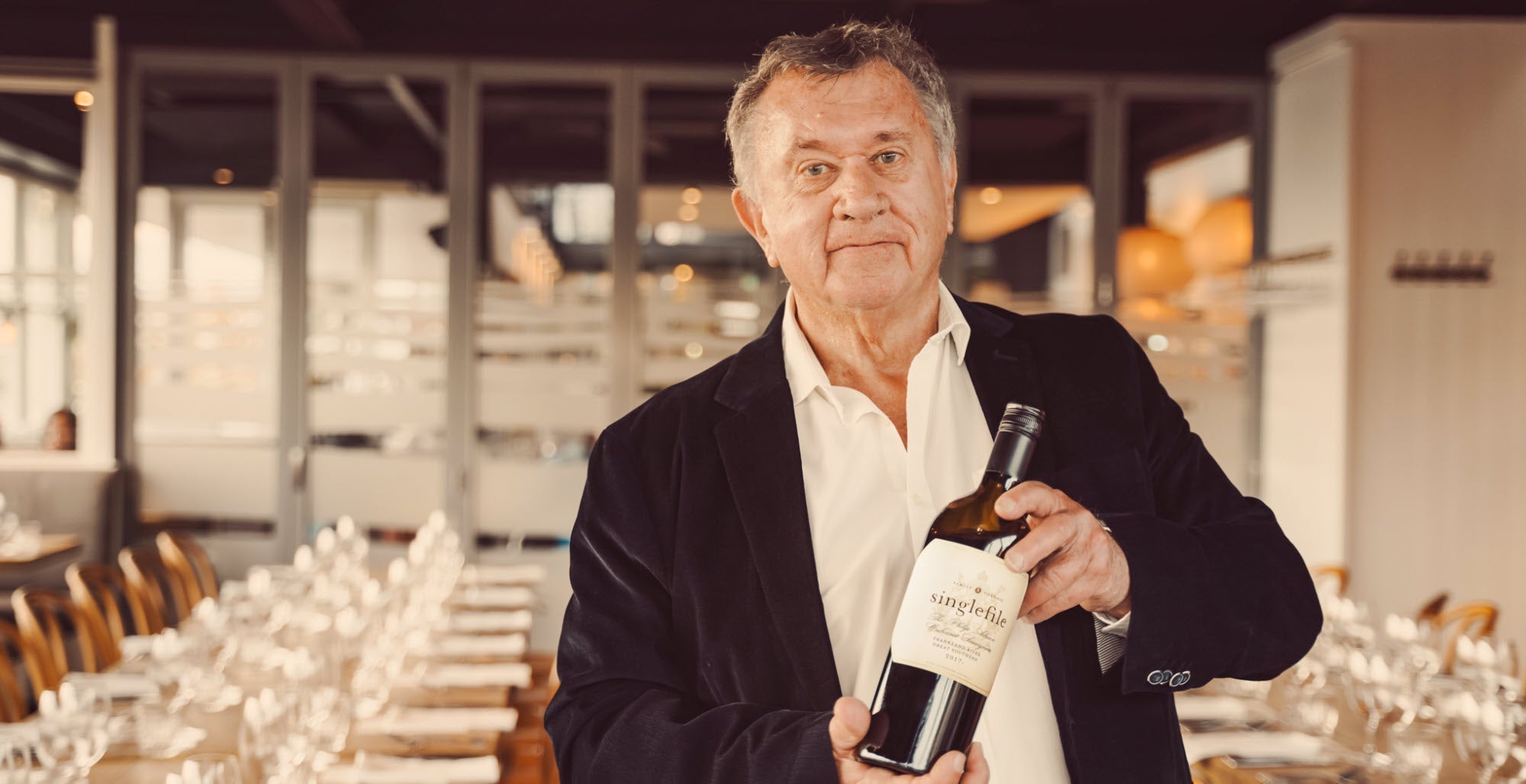 Phil holding a bottle of 'The Philip Adrian' Cabernet Sauvignon