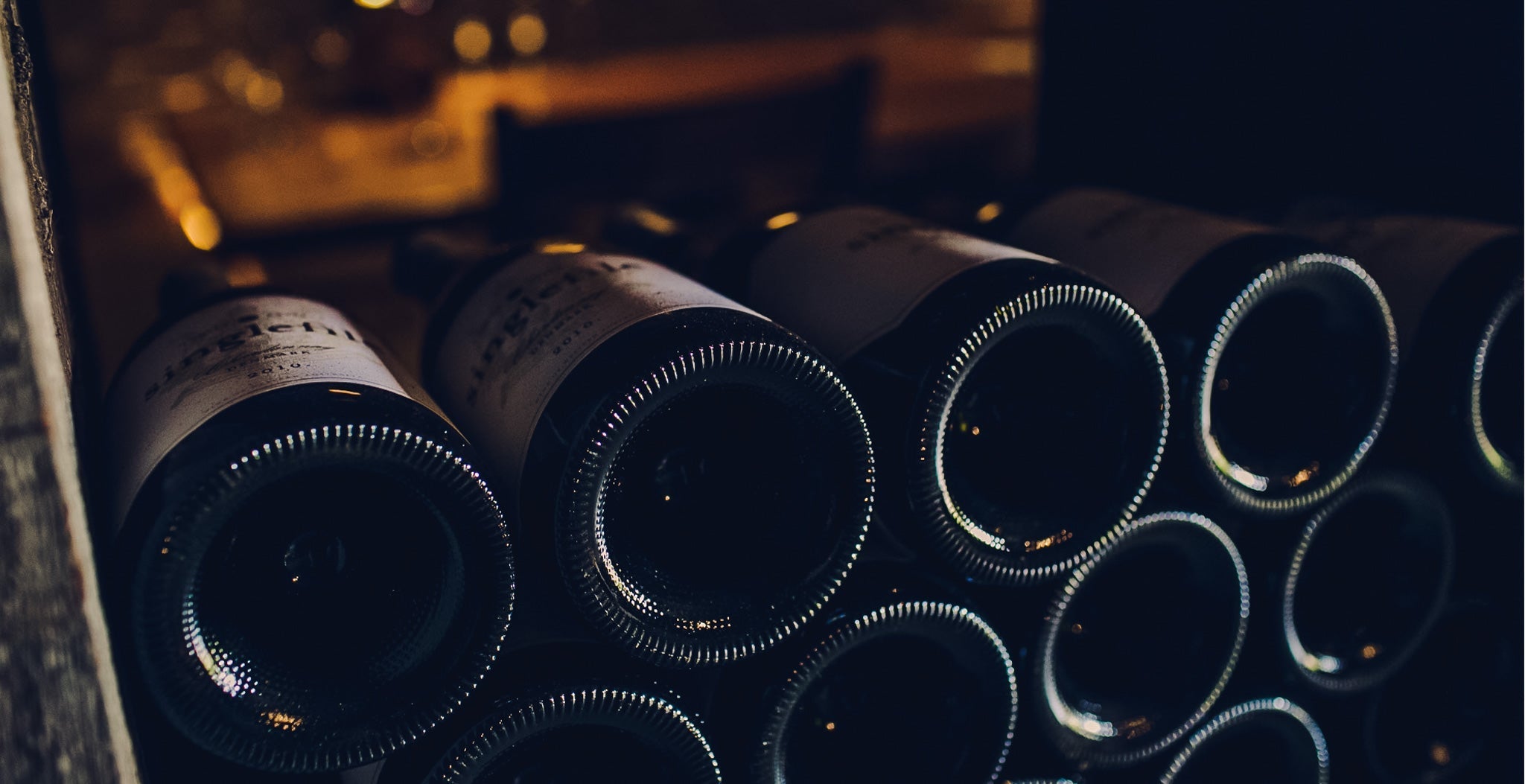 Wine bottles laying down in the cellar